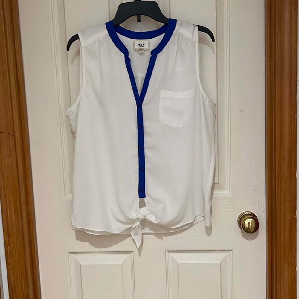 Sleeveless white with blue piping and tie bottom